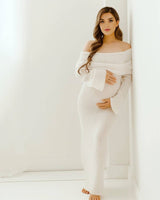 Front view of a white off-shoulder long-sleeve maternity dress with a flowing skirt