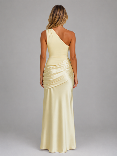 Side view showing the ruched waist and hip detailing of the maxi dress