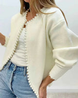 Rear view of relaxed fit open front cardigan showing frayed hem detail