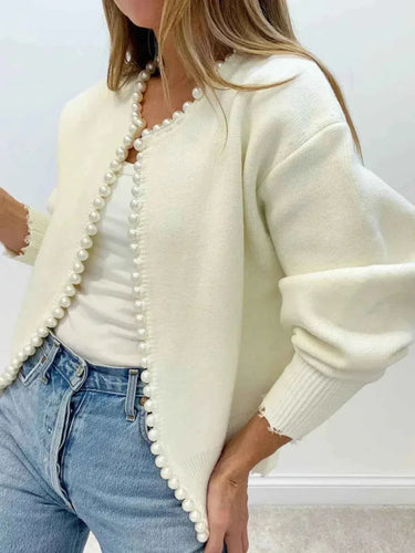 Rear view of relaxed fit open front cardigan showing frayed hem detail