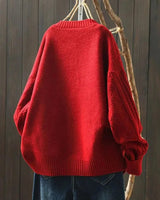 Side profile of oversized cardigan showing relaxed silhouette and length