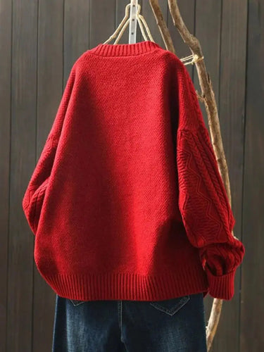 Side profile of oversized cardigan showing relaxed silhouette and length