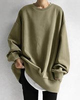 Side view of relaxed fit crewneck jumper showing full-length sleeves and hem length