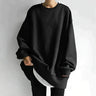 Oversized crewneck jumper with drop shoulders and tunic-length hem, front view