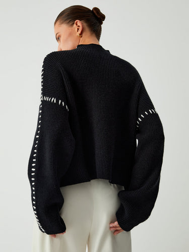 Detail shot of the rib-knit texture on the body of the jumper