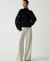Back view of the relaxed oversized jumper with contrast-stitch shoulder detail