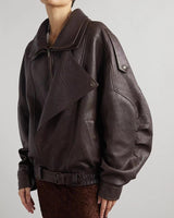 Front view of an oversized leather bomber jacket with wide collar and asymmetric zip