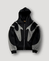 Side view of men's patchwork zip hoodie showing ribbed cuffs and hem detail