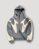 Back view of men's patchwork zip-up hoodie with streetwear-style panelling