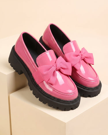 Underside of loafer showing chunky rubber lug sole pattern