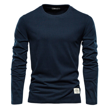 Man wearing a plain long sleeve crew neck top, front view