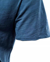 Close-up of the chest area showing the plain fabric and V-neck finish