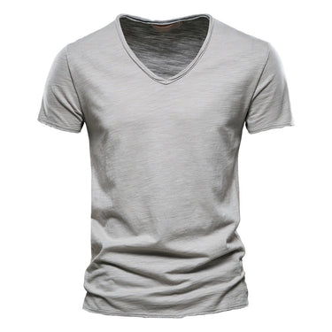 Close-up of the stitched hem on the plain T-shirt