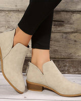 Back view of ankle boots showing zip closure and stacked block heel