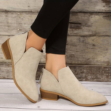 Back view of ankle boots showing zip closure and stacked block heel