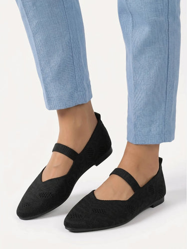 Ballet flat styled with tailored trousers, three-quarter view
