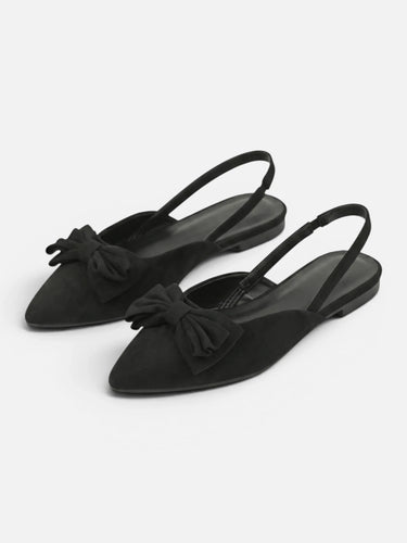 Side view of slingback flat showing adjustable back strap and flat sole