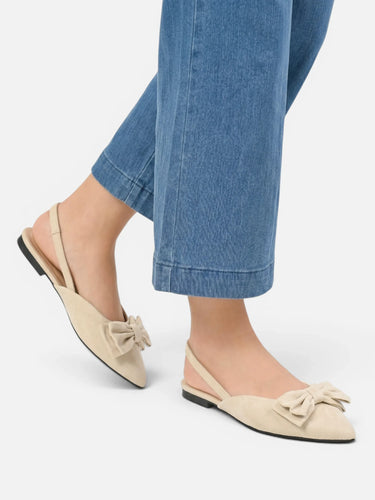 Close-up of structured bow detail on the vamp of the slingback flat
