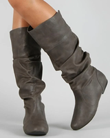 Rear view of women's pull-on mid-calf leather boots with flat sole