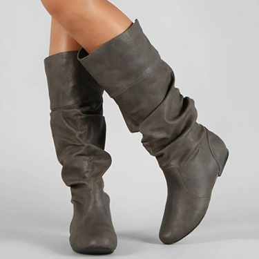 Rear view of women's pull-on mid-calf leather boots with flat sole