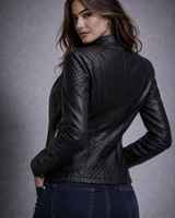 Side view showing the hip-length silhouette and zipped cuffs of the biker jacket