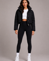 Front view of a cropped quilted puffer jacket with a fitted hood and full-length zip