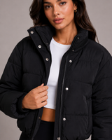 Rear view of the hooded cropped puffer jacket showing hood and back panel