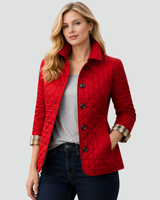 Side profile showing the tailored silhouette of the quilted jacket