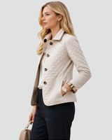 Three-quarter view of the quilted jacket showing collar and stitching
