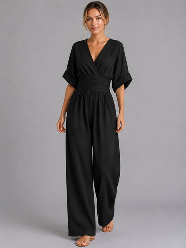 Detail shot of the V-neckline on the denim jumpsuit