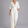 Front view of a wide-leg denim jumpsuit with V-neckline and cinched waist