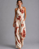 Full-length view of the jumpsuit in red with printed pattern and wide-leg cut