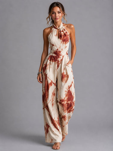 Full-length view of the jumpsuit in red with printed pattern and wide-leg cut