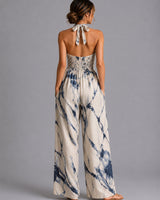 Close-up of the halter tie neckline and fabric texture on the black colourway
