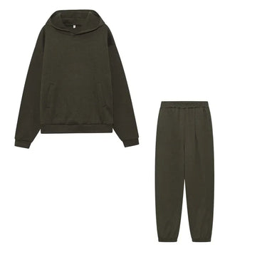 Model seated wearing the matching hoodie and jogger set