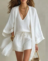 Front view of a three-piece linen co-ord set with V-neck top and drawstring shorts