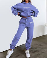 Women's jogging set shown in blue, front-facing full-length view