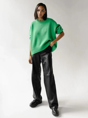 Flat lay of an oversized long-sleeve sweater in dark brown