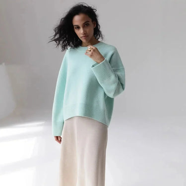 Back view of an oversized round neck sweater in black