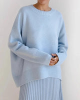 Front view of an oversized round neck sweater in black with long sleeves