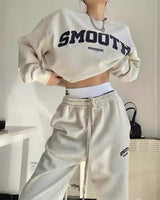 Side view of the grey two-piece sweatshirt and jogger outfit set