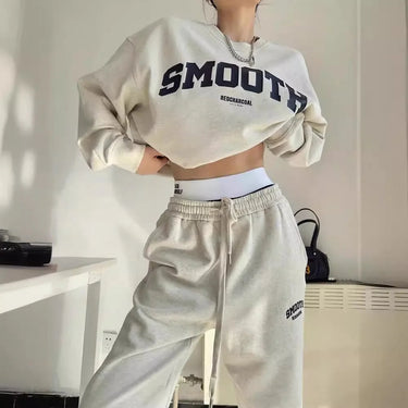 Side view of the grey two-piece sweatshirt and jogger outfit set
