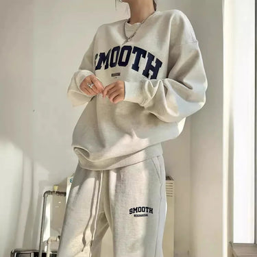 Close-up of the sweatshirt neckline and sleeve detail of the grey co-ord set