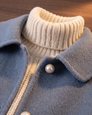 Detail shot of hip-level patch pocket on a wool jacket