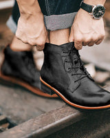 Front view of men's full-grain leather boot showing round toe and lace-up detail