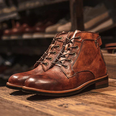 Close-up of dual zip and lace-up closure on men's leather boot