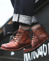 Rear view of leather boot showing heel pull tab and rubber outsole