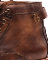 Pair of retro men's leather boots shown side by side on neutral background