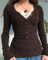 Close-up of roll neck collar and top button detail