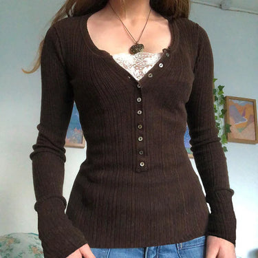 Close-up of roll neck collar and top button detail